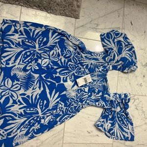 Blue and white dress gauze  material. Elastic bust area low cut back NTW.